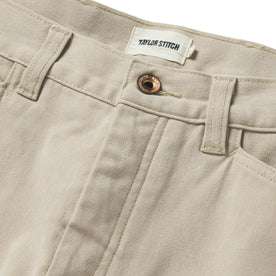 material shot of the button closure on The Shaper Short in Sand Boss Duck