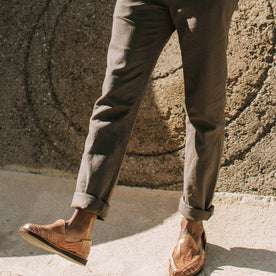 our fit model wearing The Gibson Trouser in Gravel—cuffed with slip on shoes