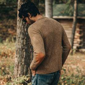 our fit model wearing The Hardtack Sweater in Oak Donegal—seen from left side angle with full back visible