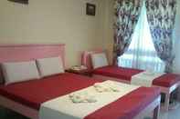 Kamar Tidur Sunday Flower Hotel