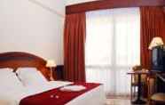 Kamar Tidur 4 Triumph Hotel and Conference Center