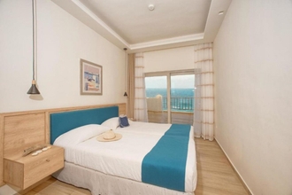 Kamar Tidur 4 Hotel and Studios Cavos Bay