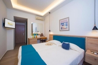 Kamar Tidur Hotel and Studios Cavos Bay