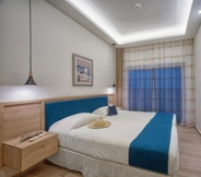 Kamar Tidur 6 Hotel and Studios Cavos Bay