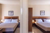 Kamar Tidur Theo Hotel