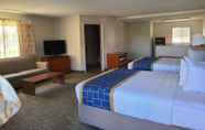Bedroom 5 Days Inn & Suites by Wyndham Orlando East UCF Area