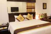 Kamar Tidur May De Ville Grand Hotel