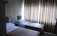 Bedroom 2 Aura Hotel