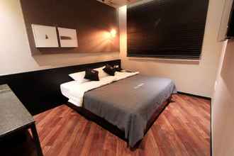 Kamar Tidur 4 Brown Dot Hotel Beom il