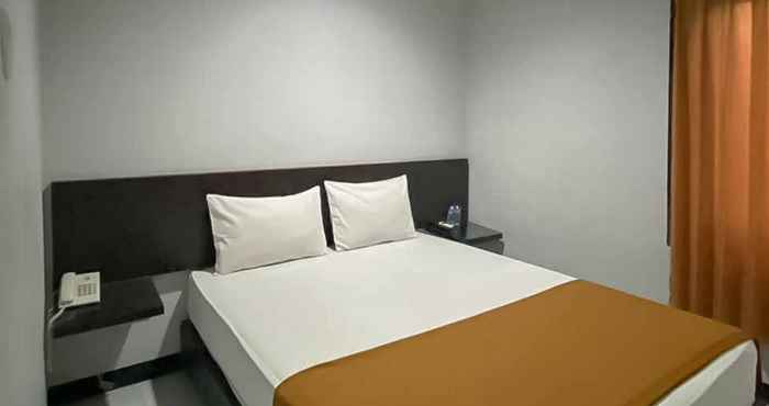 Kamar Tidur Losmen Family Syariah Bypass Juanda Mitra RedDoorz