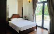 Phòng ngủ 5 Dinh Gia Home Villa & Resort