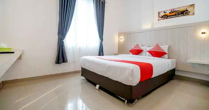 Kamar Tidur OYO Life 1299 Balcony Orange Homestay