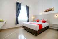 Kamar Tidur OYO Life 1299 Balcony Orange Homestay