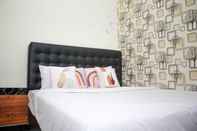 Kamar Tidur Capital O 2258 Santana Syariah Guest House