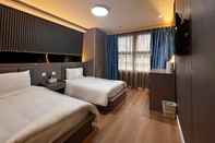 Kamar Tidur Hennessy Hotel