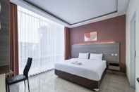 Kamar Tidur Cove West Inn Cihampelas