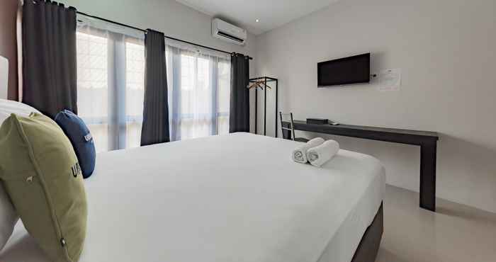 Kamar Tidur Urbanview Hotel Yoga Palangkaraya by RedDoorz