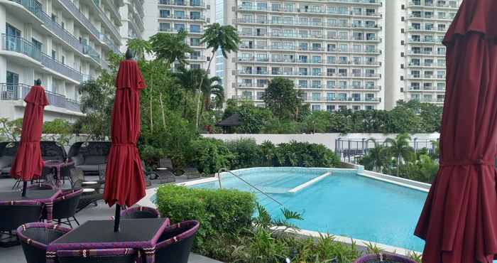 Kolam Renang Capital O 950 AHM Suites at ACQUA