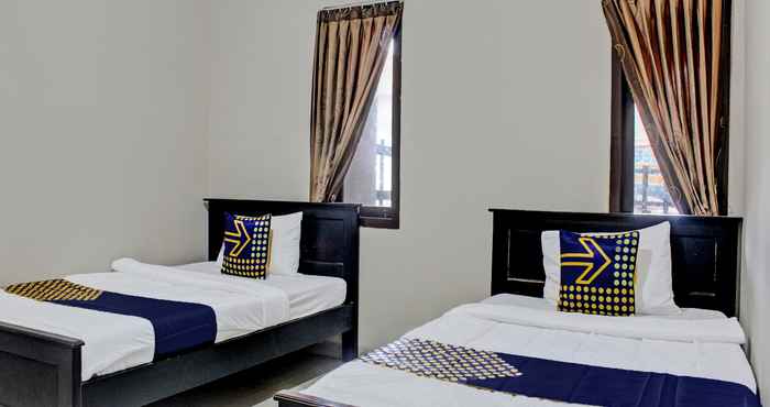 Bedroom OYO Life 92509 Maulana Guest House Simpur