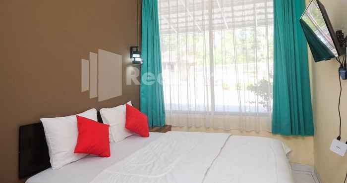 Kamar Tidur Travelista Homestay near GOR Candradimuka Semarang Mitra RedDoorz