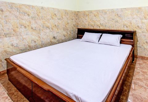 Phòng ngủ OYO 92655 Gian Homestay Near Masjid Al-Ihsan