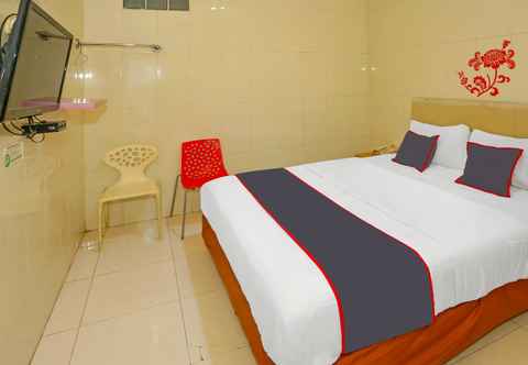 Bedroom Capital O Hotel Sion Holiday Tangerang