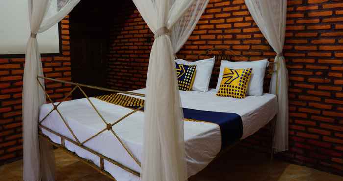 Bedroom SPOT ON 92698 Holy Homestay