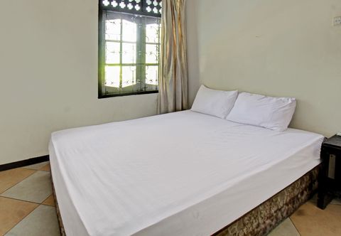 Bedroom OYO 92750 Motel Langko