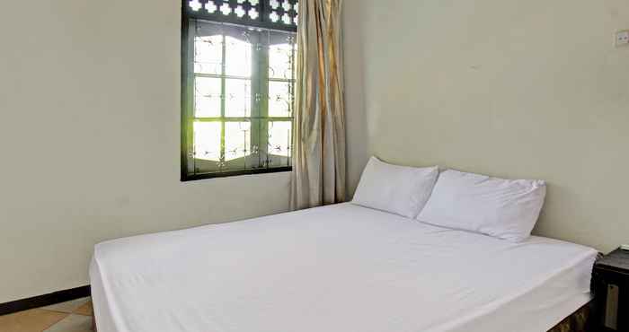 Bedroom OYO 92750 Motel Langko
