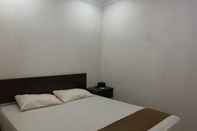 Bedroom OYO 92899 Penginapan Laota Syariah