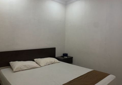 Bedroom OYO 92899 Penginapan Laota Syariah Near Rumah Sakit Islam Faisal Makassar
