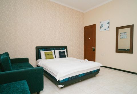 침실 Urbanview Hotel Griya Surya Malang by RedDoorz