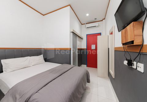 Phòng ngủ Ian Hotel Jaksa Mitra RedDoorz