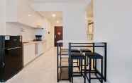 Common Space 4 Homey Living and Comfortable 2BR at Sky House BSD Apartment By Travelio