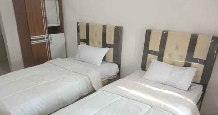 Kamar Tidur OYO 93100 Harapan Homestay Syariah