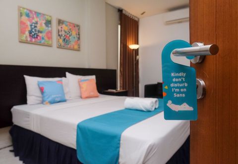 Bedroom Sans Hotel Prime Cailendra Yogyakarta by RedDoorz