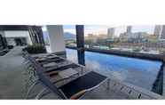 Swimming Pool 4 Stylish 2BR at Urban Suite With Infinite Pool