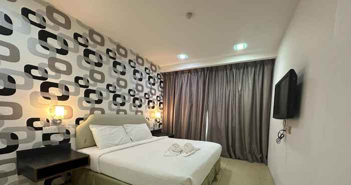 Kamar Tidur Alia Express Twelve Hotel