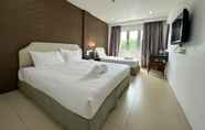 Kamar Tidur 3 Alia Express Twelve Hotel