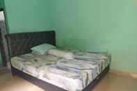 ห้องนอน OYO 93306 Rinjani Guest House