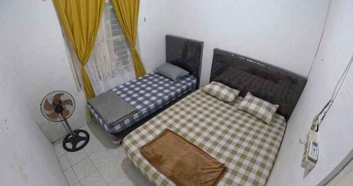 ห้องนอน Omah Niten Guesthouse Jogja