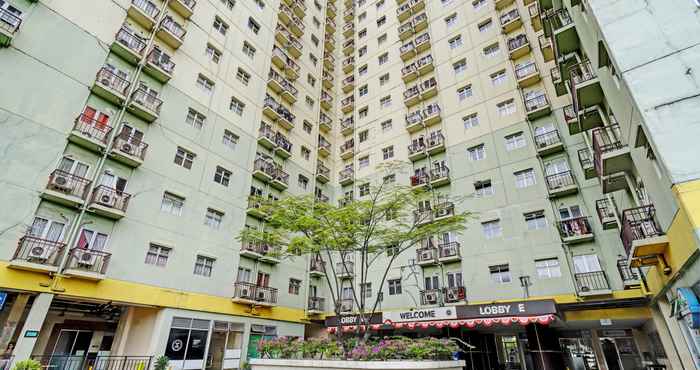 Bangunan OYO 93426 Metro Suites Apartment By Goodvibes