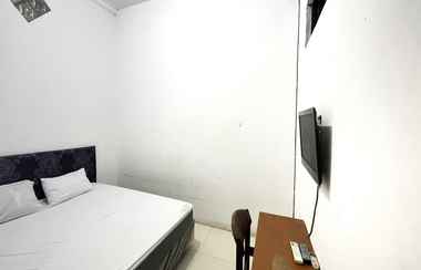 Kamar Tidur 2 OYO 93522 Penginapan Kryani