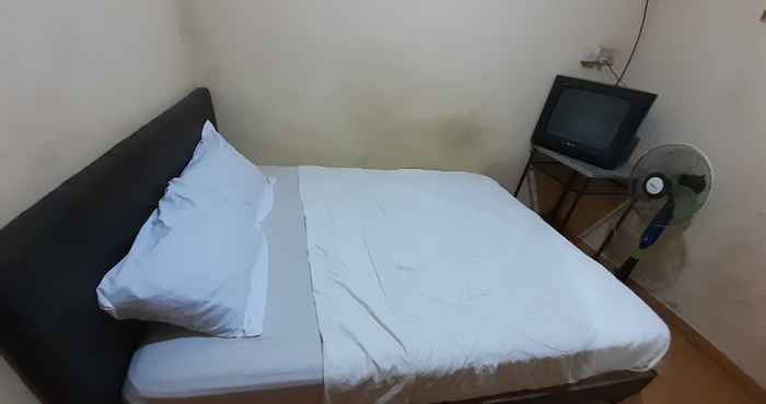 Bedroom SPOT ON 93776 Intan Homestay