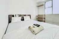 ห้องนอน RedLiving Apartemen Urbantown Serpong - Aurora Rooms