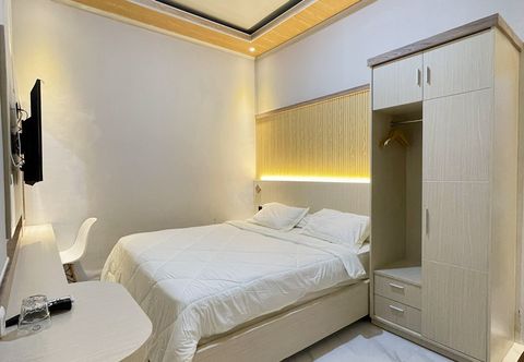 ห้องนอน Urbanview Hotel Wollangi Syariah Panakkukang Makassar