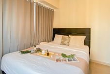 Bedroom Simple and Warm 2BR at Meikarta Apartment By Travelio