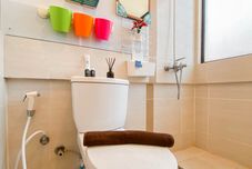 In-room Bathroom Simple and Warm 2BR at Meikarta Apartment By Travelio