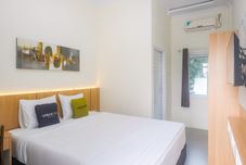 Bedroom Urbanview Hotel Syariah Astungkara Space Sleman by RedDoorz