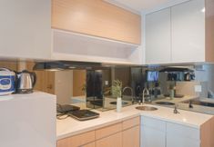 Common Space 6 Modern 2BR Tamansari Iswara Apartment By Travelio